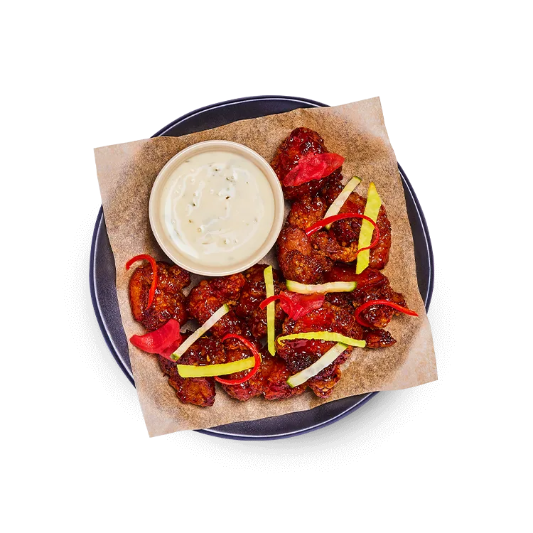Wagamama hot honey fried chicken with firecracker, mixed pickles and zesty vegan mayo on the side