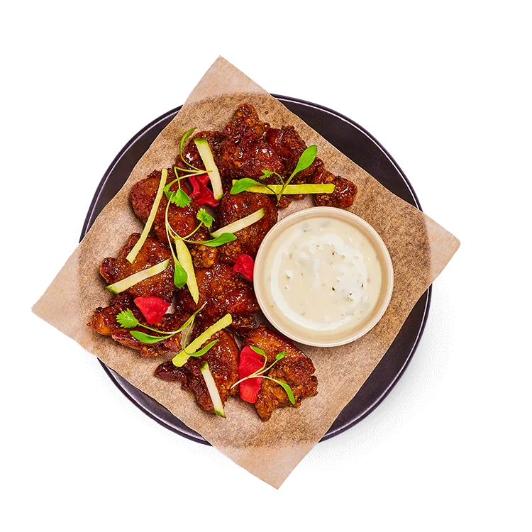 Wagamama hot honey fried chicken with teriyaki, mixed pickles and zesty vegan mayo on the side