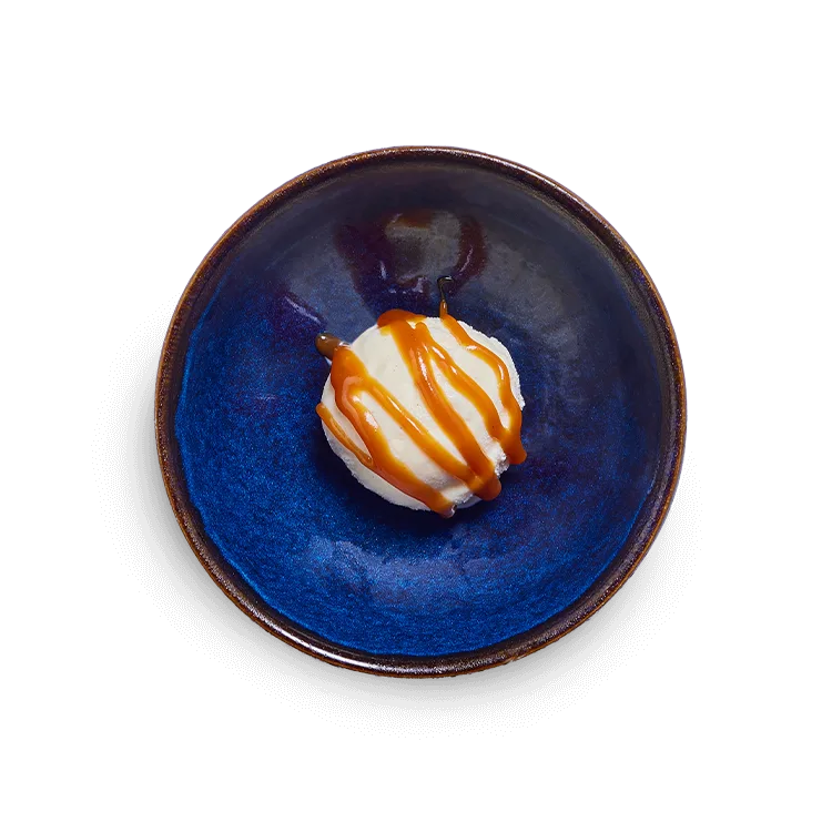 Wagamama kids vanilla pod ice cream with toffee sauce, one scoop of vanilla ice cream and toffee sauce