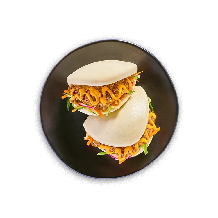 Wagamama korean barbecue brisket bao buns, fresh asian slaw and sriracha vegan mayo