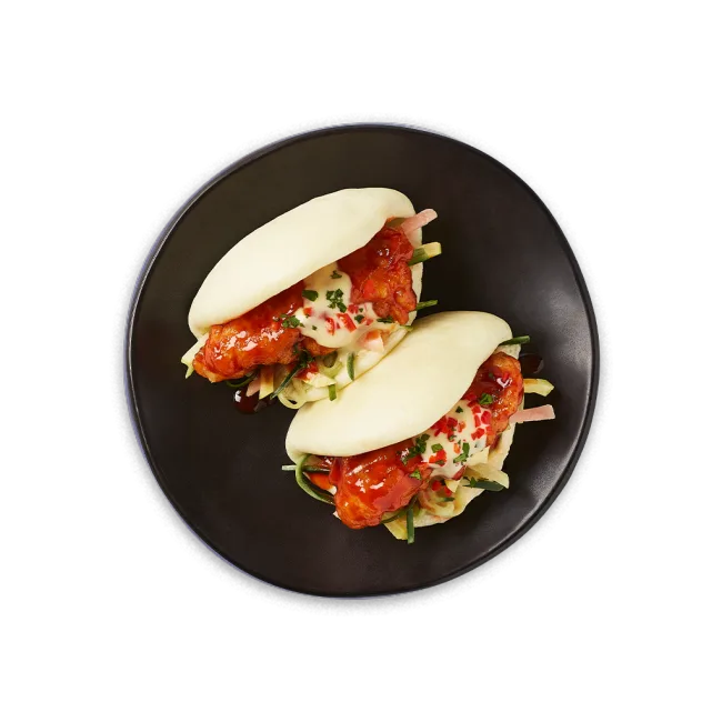 Wagamama korean fried chicken bao buns, pickled rainbow slaw, gochujang sauce and yuzu mayo